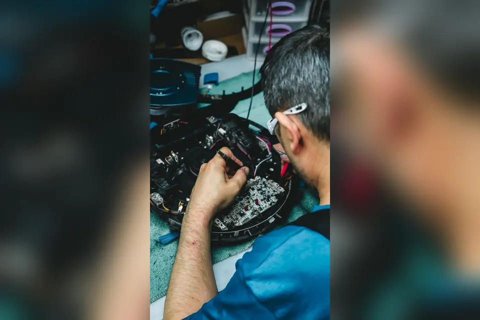 Technician Repairing Electronics Circuit Board