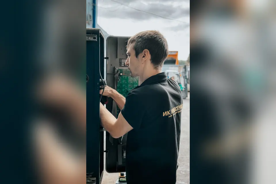 Technician Working on Outdoor Electrical Panel