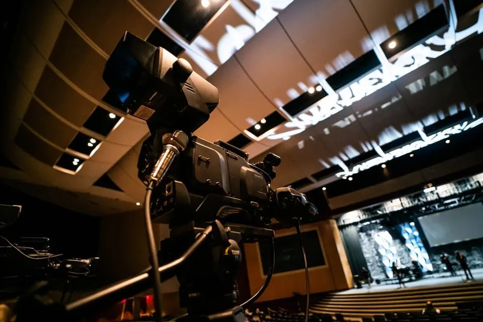 Professional Camera Setup in Modern Auditorium