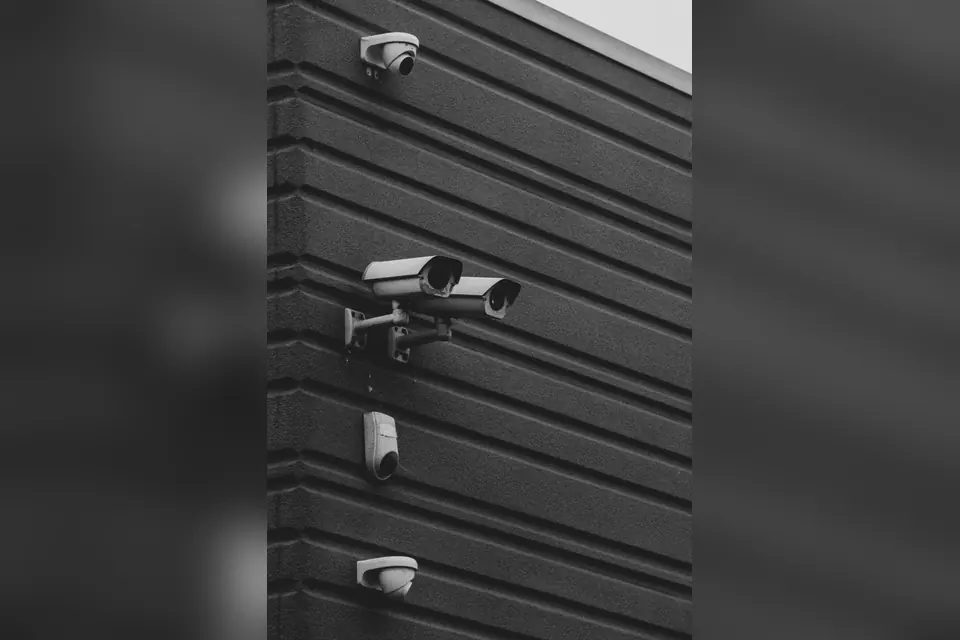Black and White Security Cameras on Modern Building