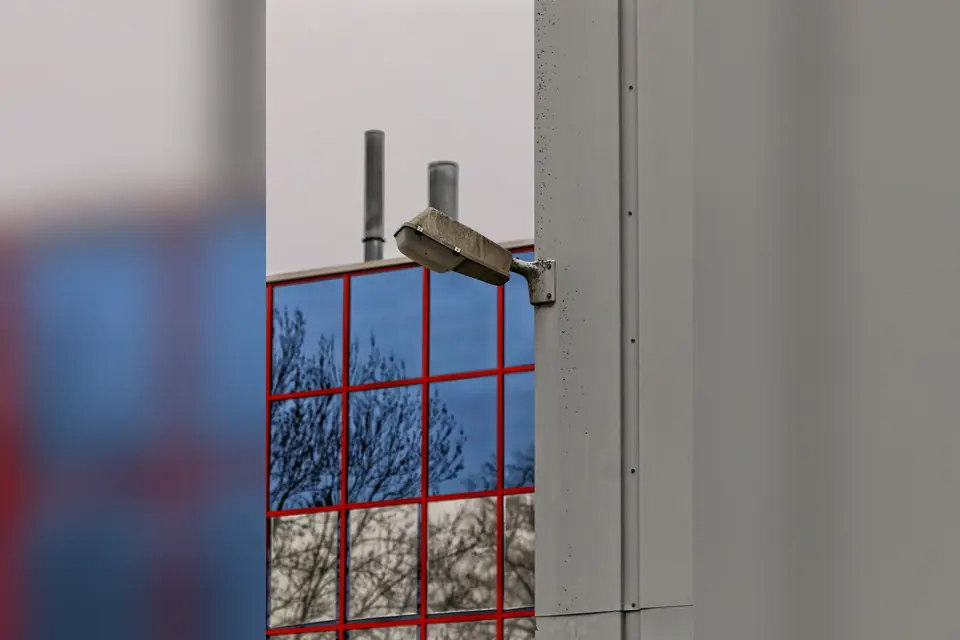 Security Camera Monitoring Reflected Building Exterior