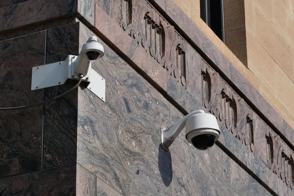 Modern Security Cameras on Urban Building Corner