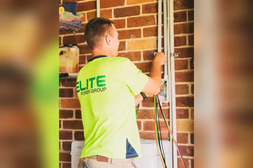 Electrician Installing Cables in Home Setup